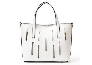 Unique hollow design Fashion Ladies Handbags solid anti wear nail on bottom