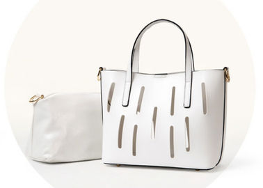 Unique hollow design Fashion Ladies Handbags solid anti wear nail on bottom
